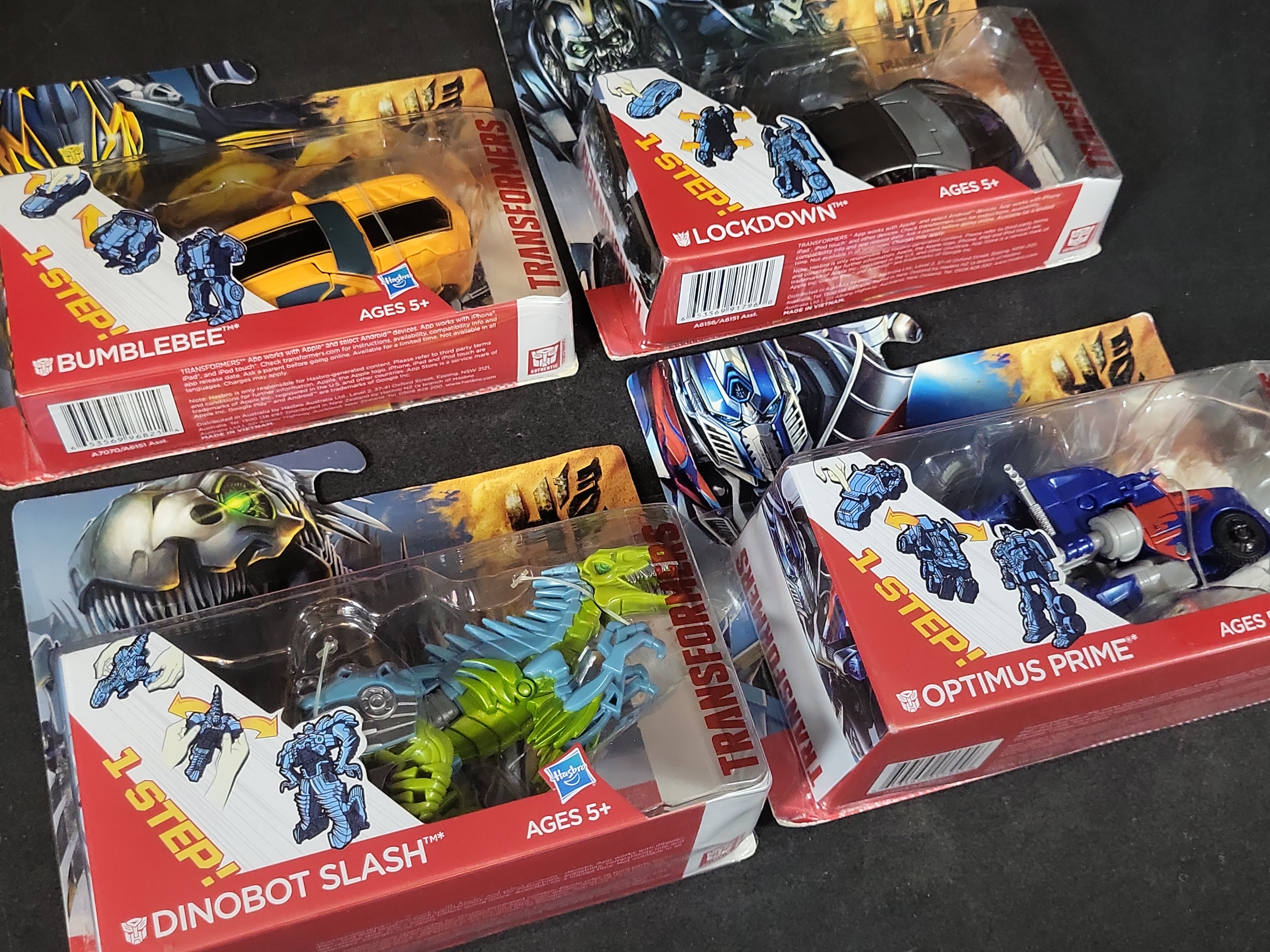 I03519 | Four Hasbro Transformers Age of Extinction 1-Step Changers Action Figures