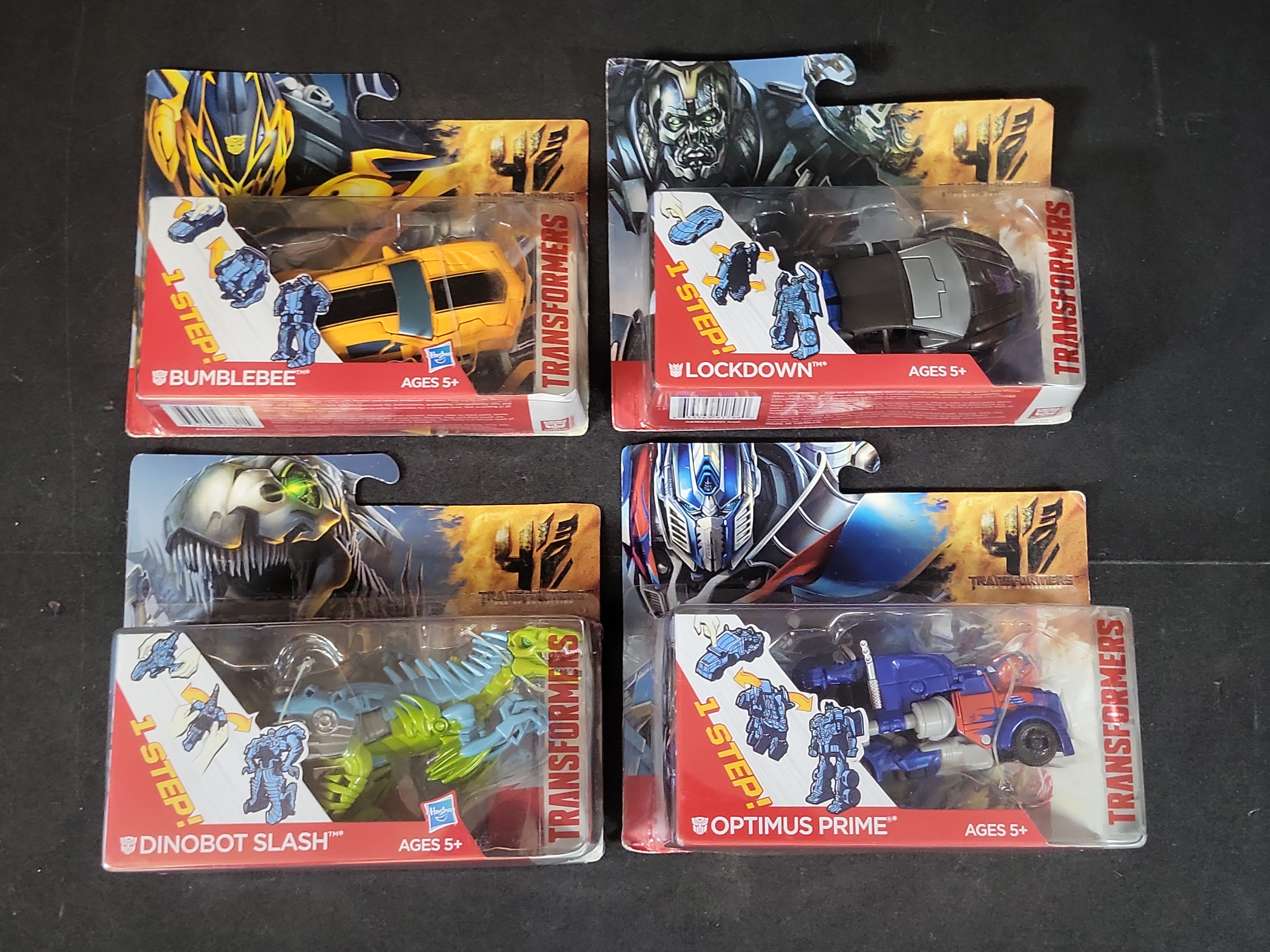 I03519 | Four Hasbro Transformers Age of Extinction 1-Step Changers Action Figures