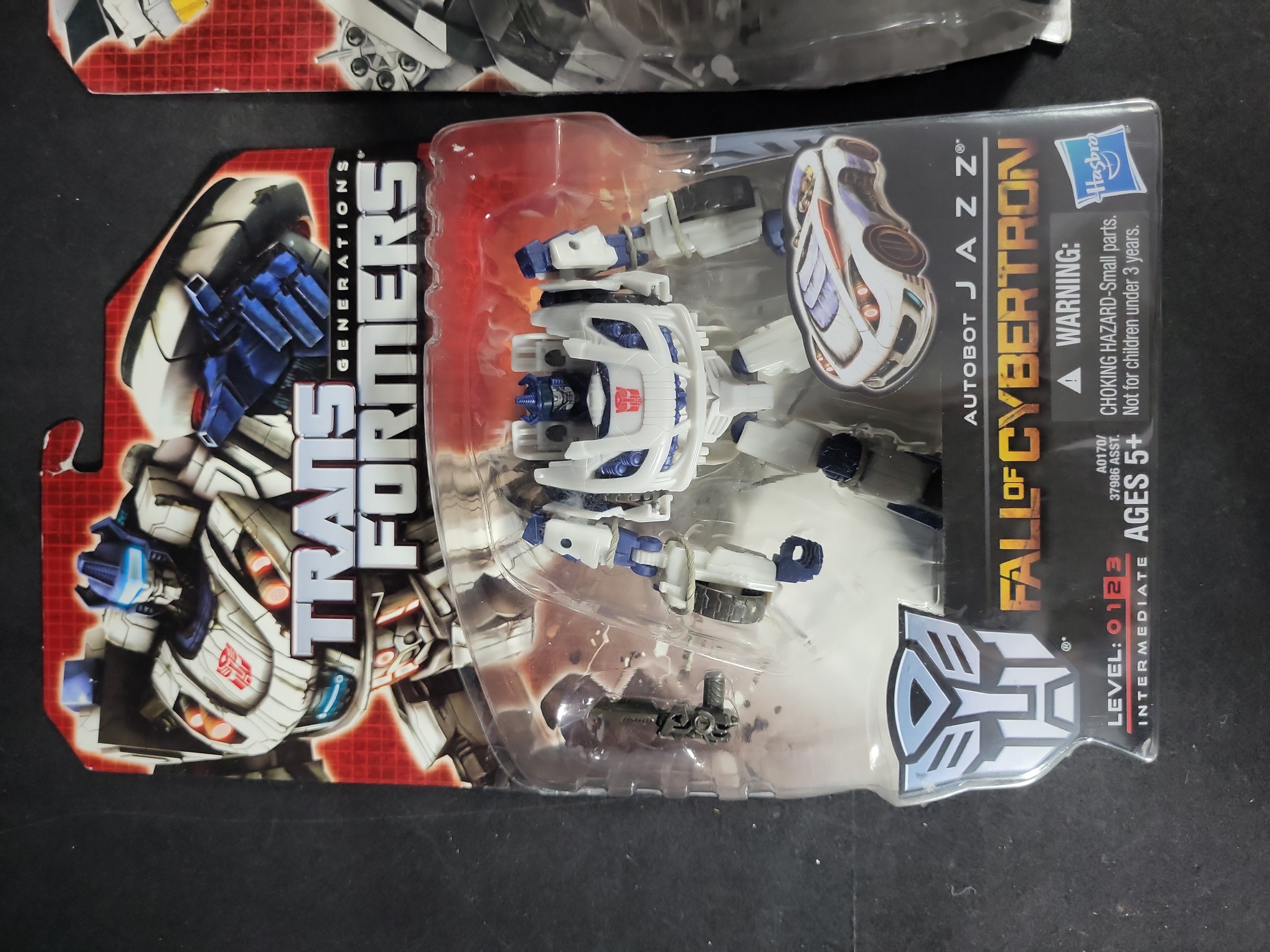 I03521 | A Pair of Hasbro Transformers Generations Fall of Cybertron Action Figures Jazz and Topspin