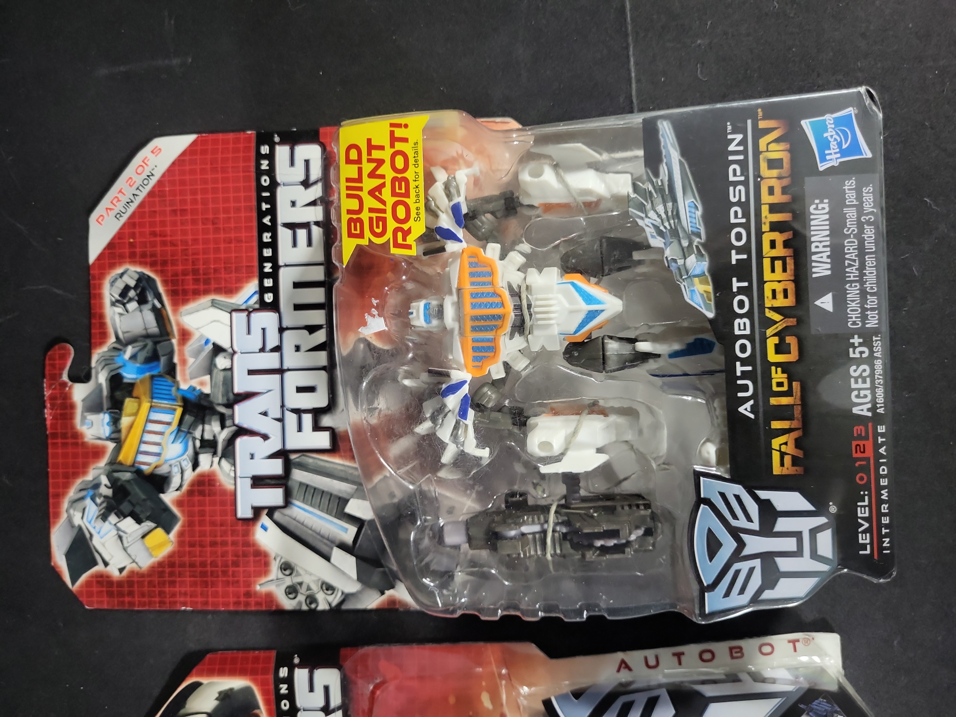 I03521 | A Pair of Hasbro Transformers Generations Fall of Cybertron Action Figures Jazz and Topspin