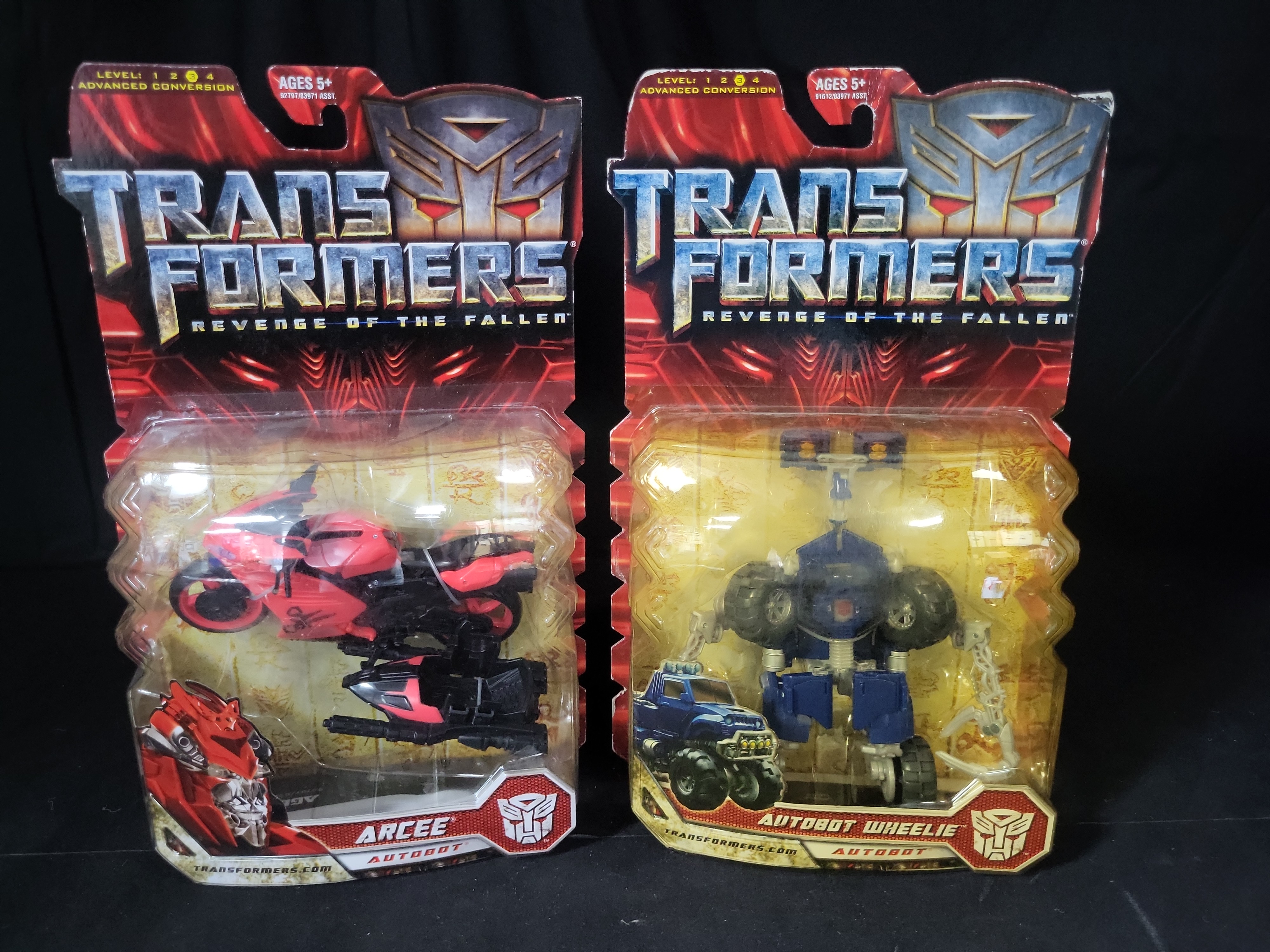 I03539 | A Pair of Hasbro Transformers Revenge of the Fallen Deluxe Class Arcee and Autobot Wheelie Action Figures