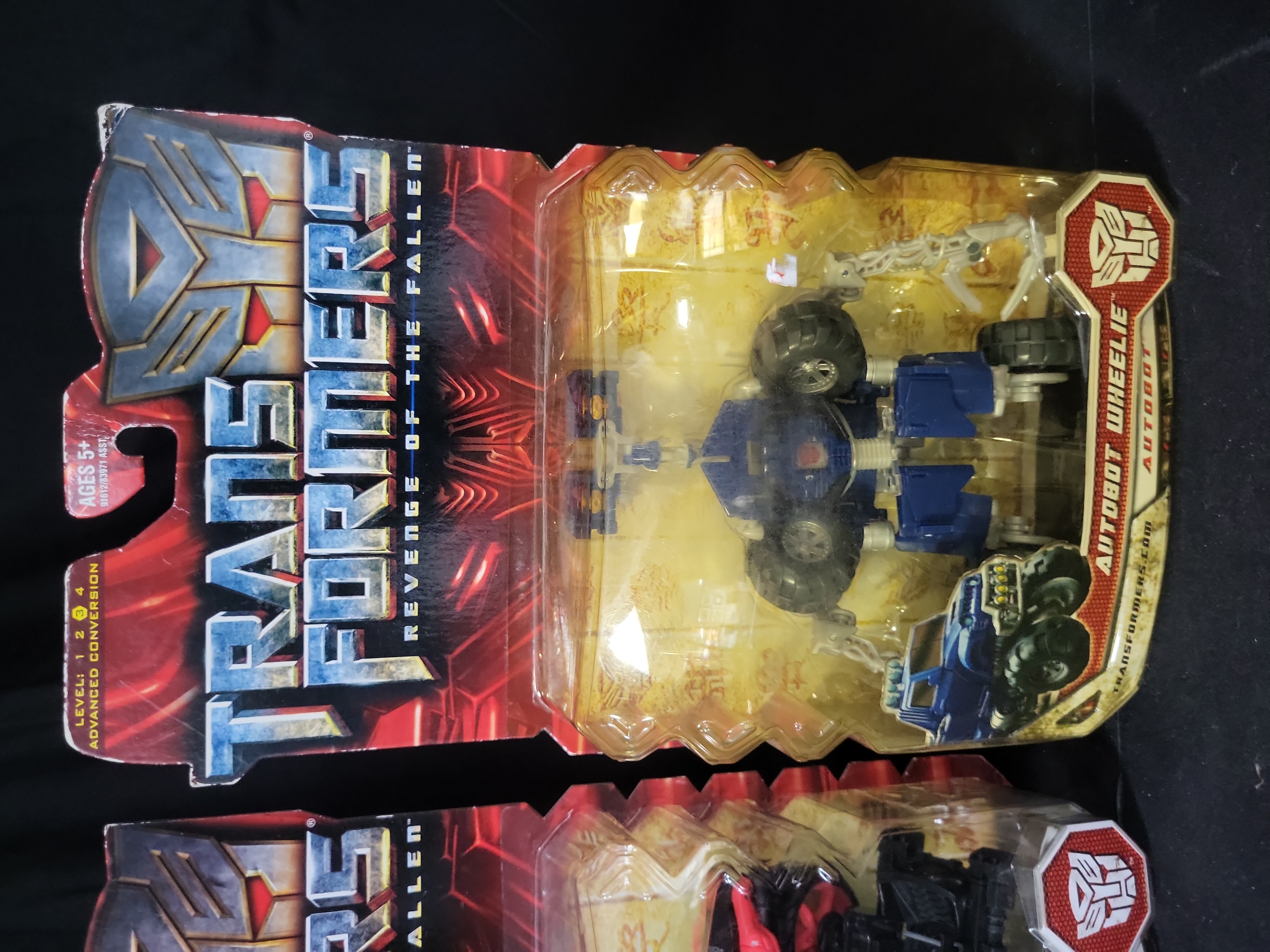 I03539 | A Pair of Hasbro Transformers Revenge of the Fallen Deluxe Class Arcee and Autobot Wheelie Action Figures