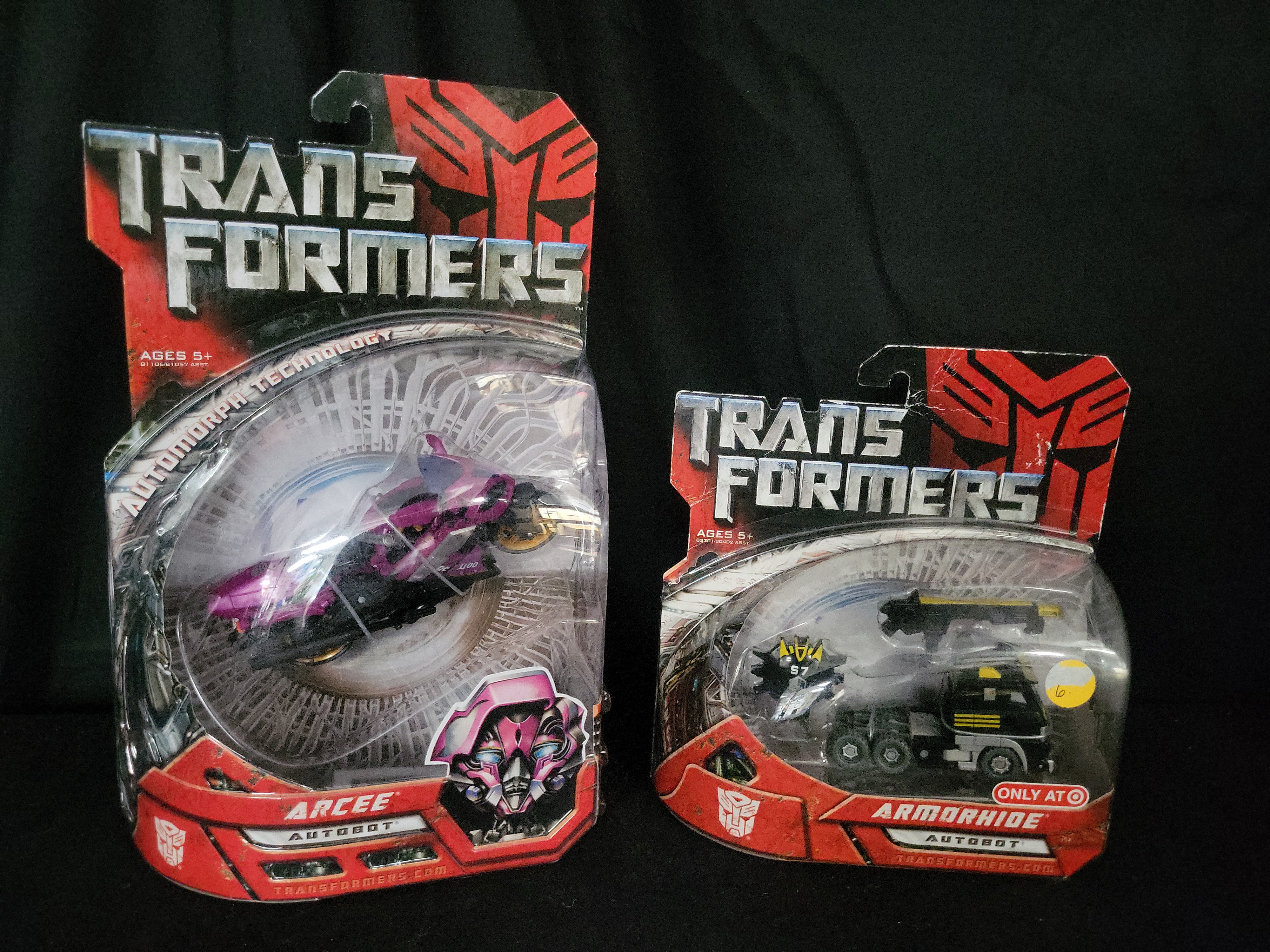I03544 | A Pair of Transformers 2007 Movie Action Figures, Arcee and Target Exclusive Armorhide