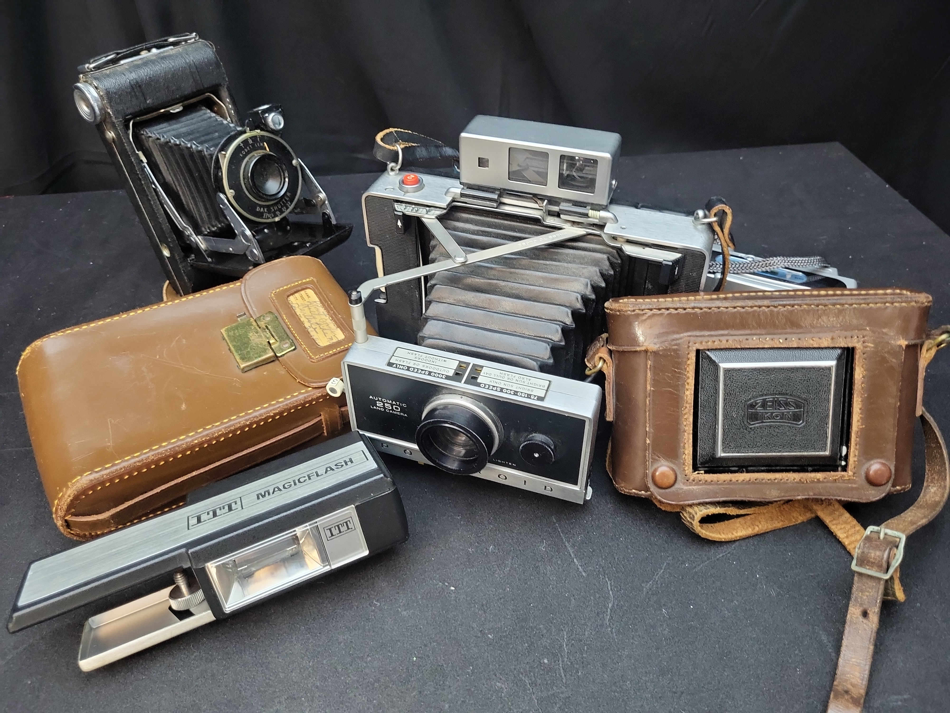 I03637 | A Collection of Vintage Folding and Instant Cameras with Accessories