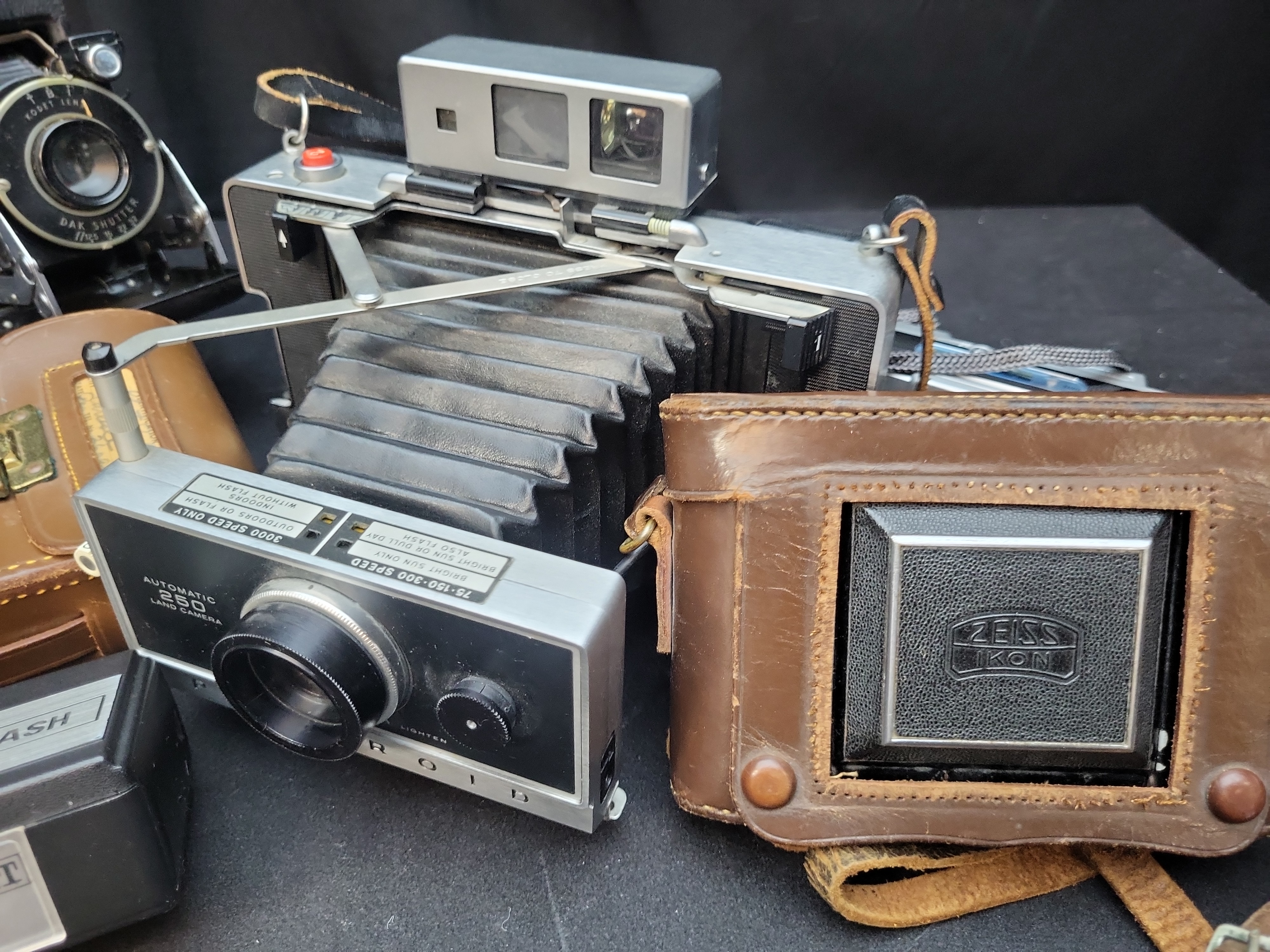 I03637 | A Collection of Vintage Folding and Instant Cameras with Accessories