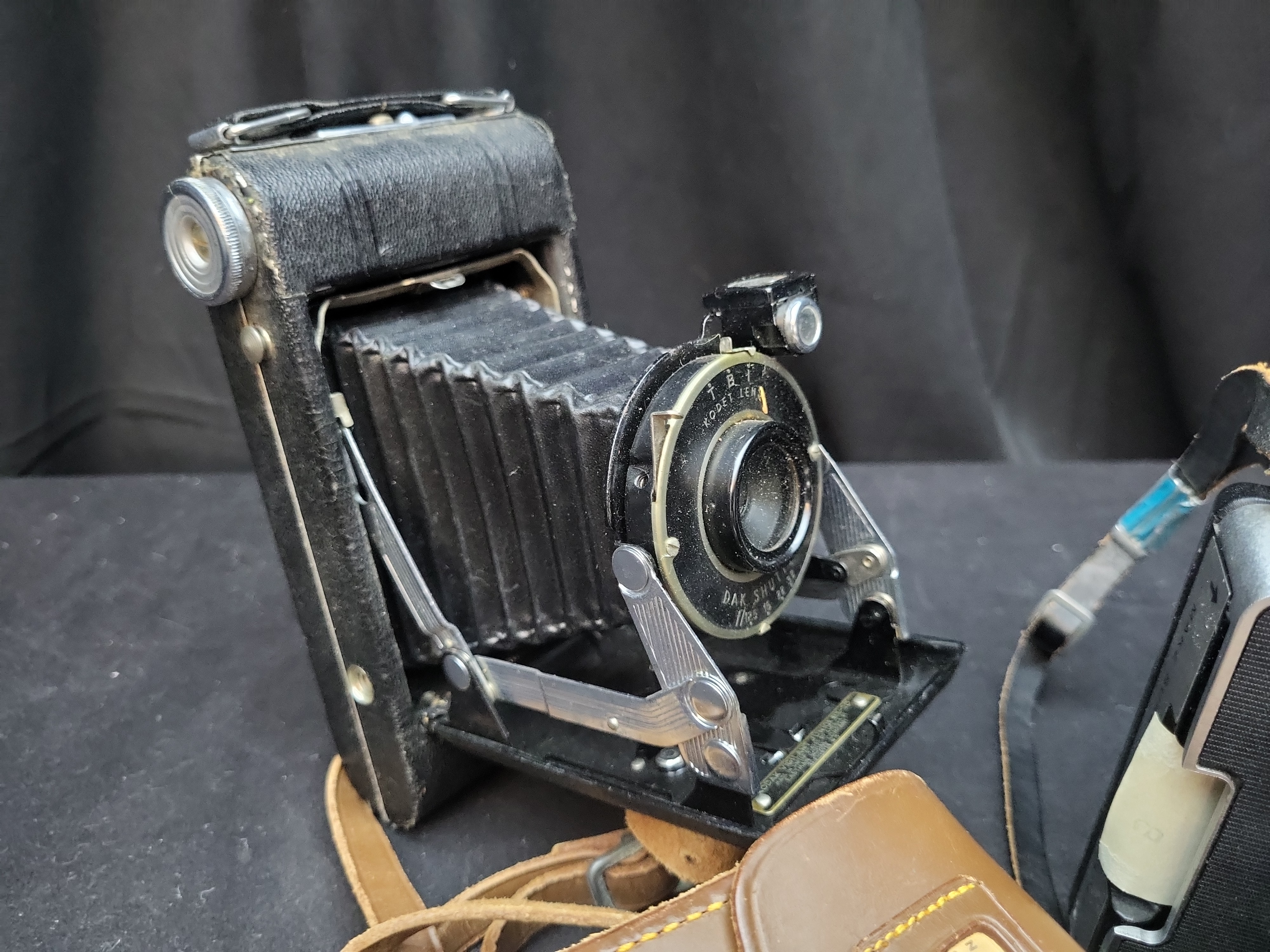 I03637 | A Collection of Vintage Folding and Instant Cameras with Accessories