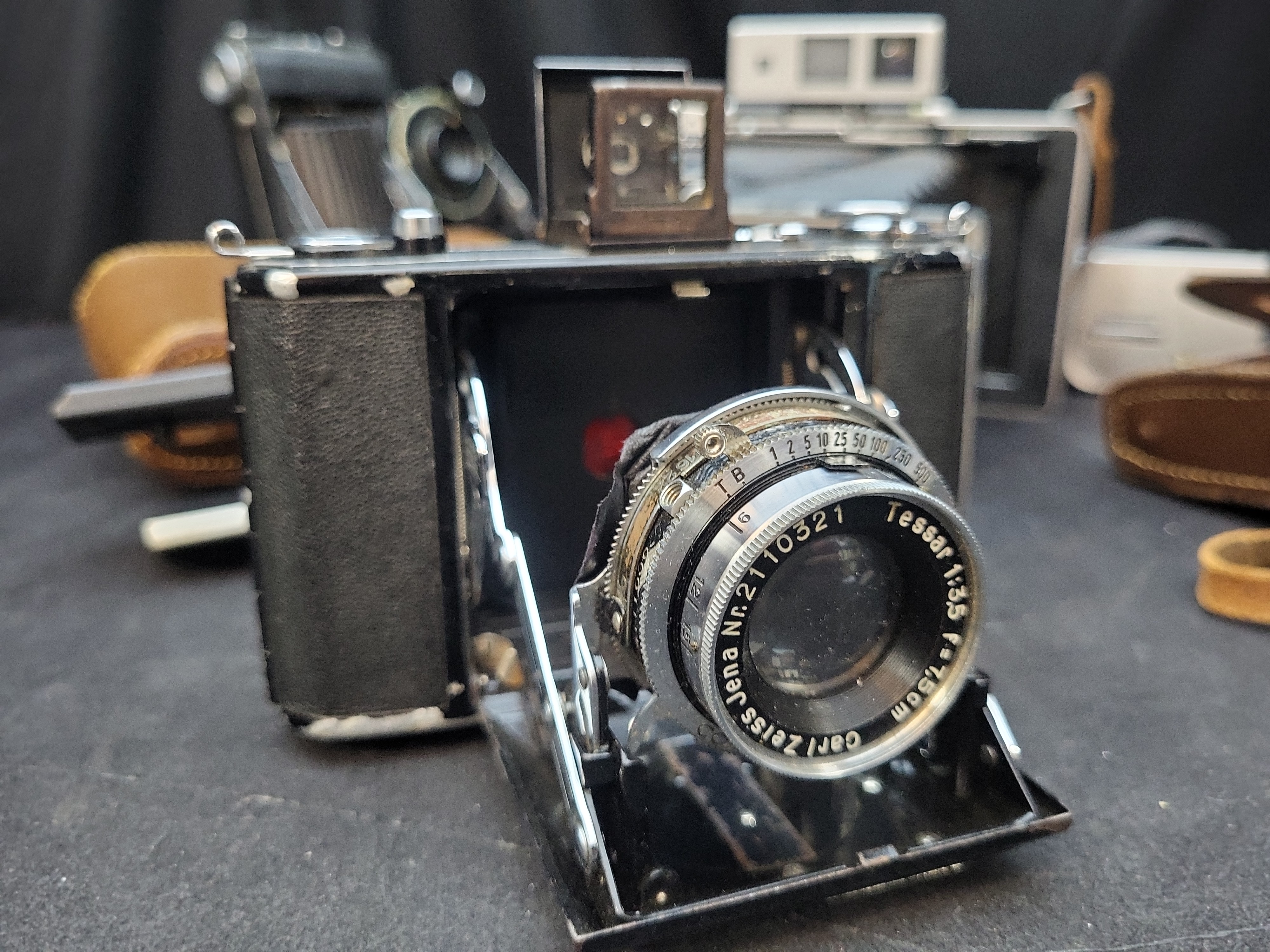 I03637 | A Collection of Vintage Folding and Instant Cameras with Accessories