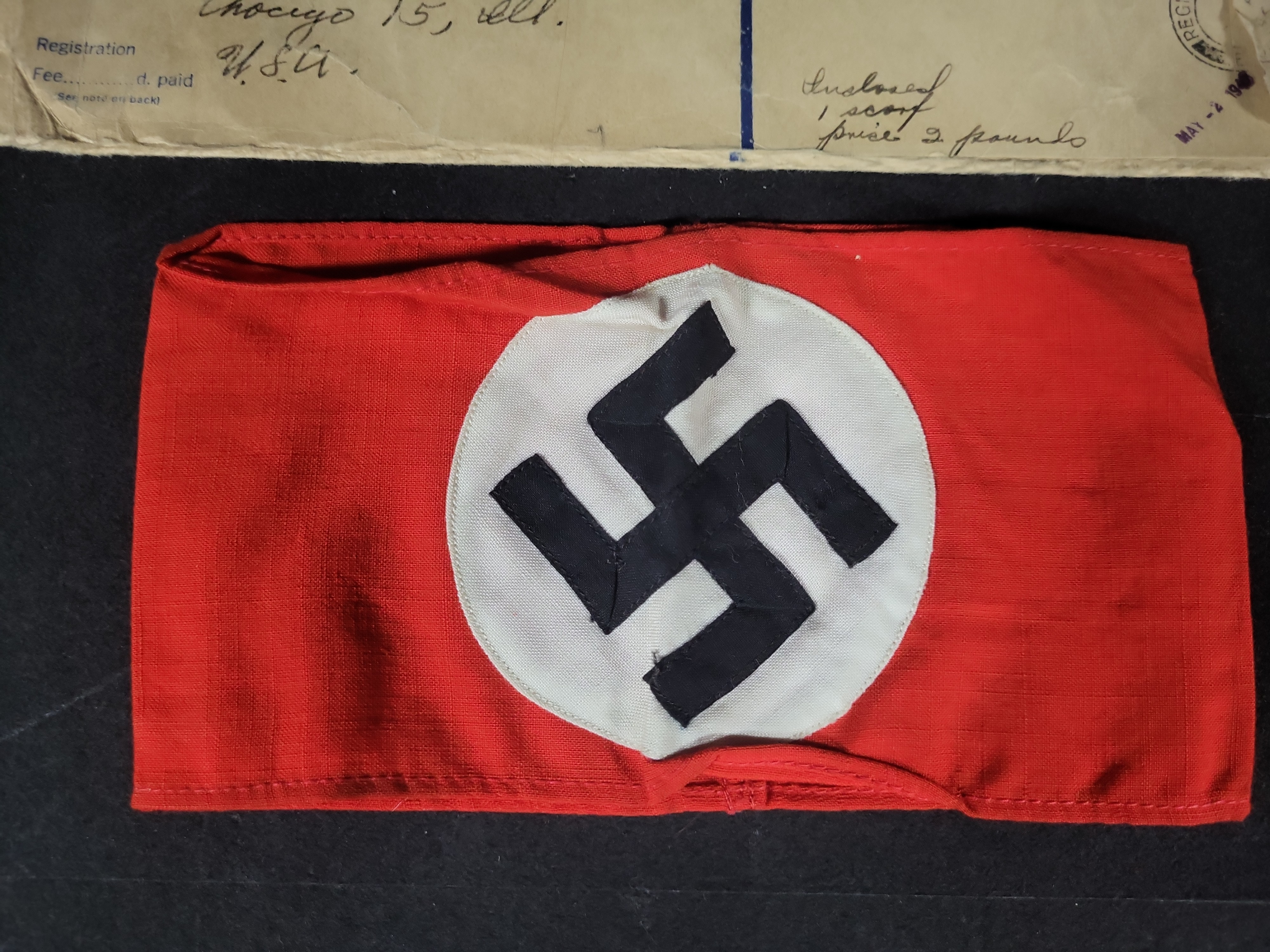I03194 | Two WWII Items Including a German NSDAP Armband and Registered Shipping Envelope
