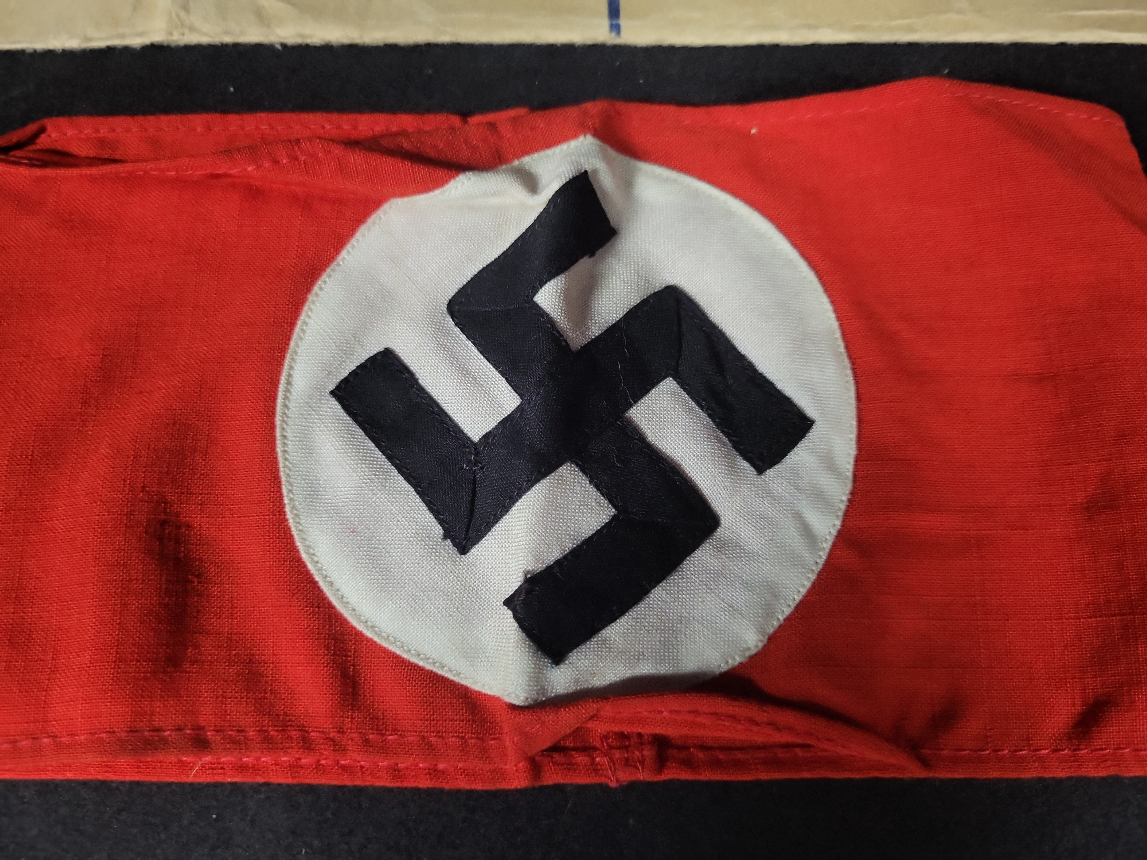 I03194 | Two WWII Items Including a German NSDAP Armband and Registered Shipping Envelope