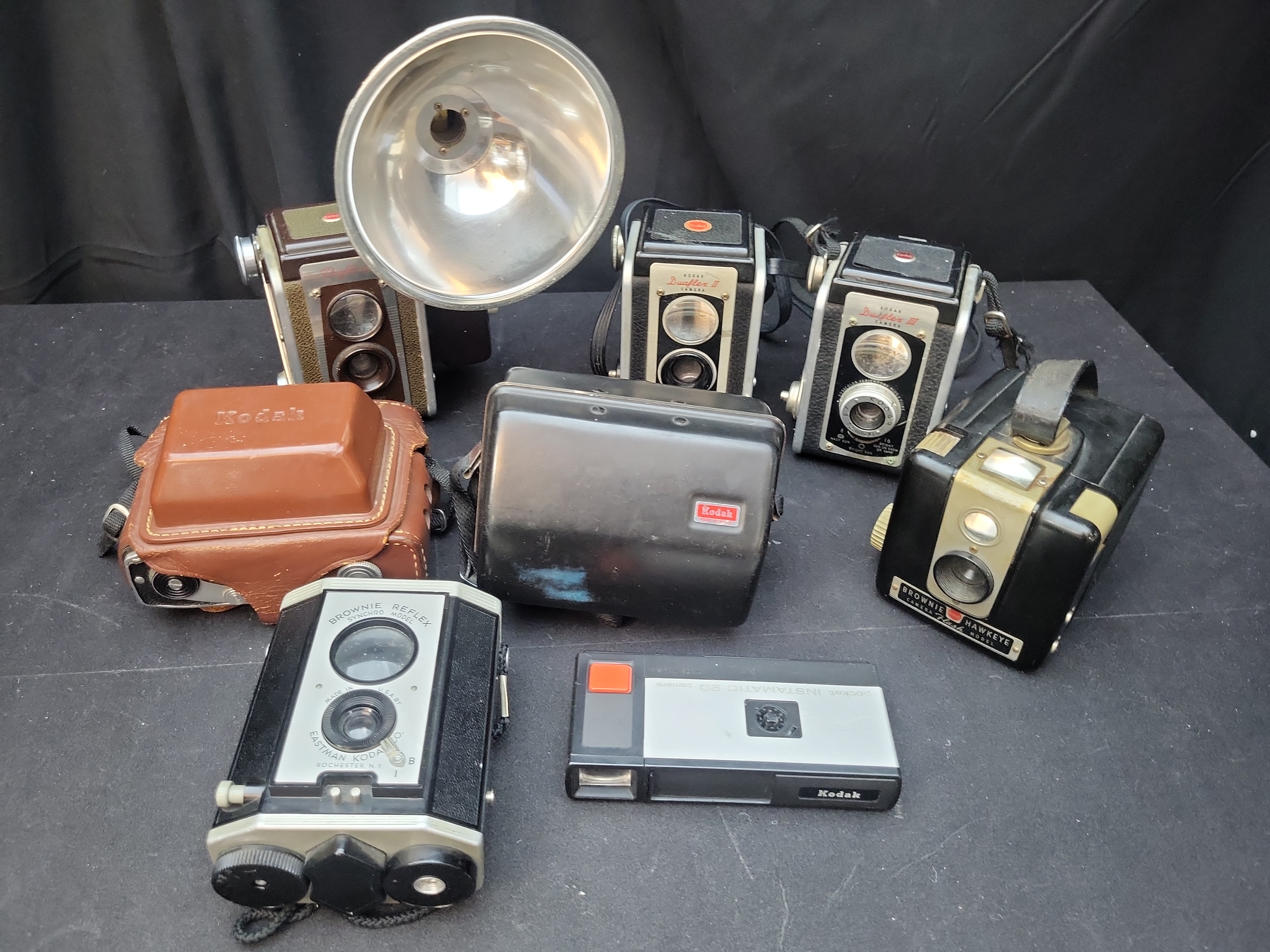 I03636 | A Collection of Eight Vintage Kodak Cameras Including Duaflex, Instamatic, and Brownie Models