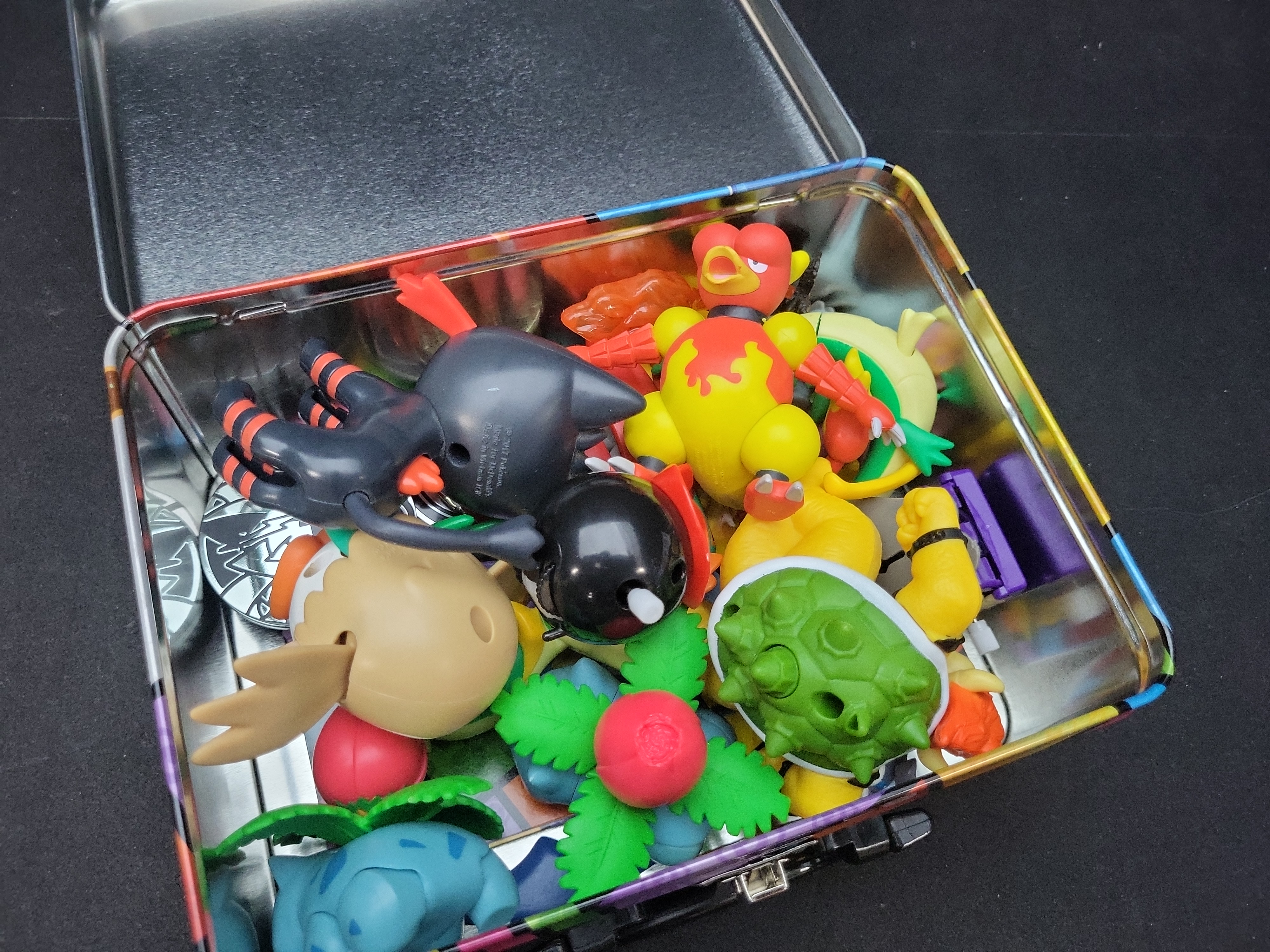 I02921 | A Collection of Pokemon TCG Collector Chest, Action Figures, and Gameplay Coins