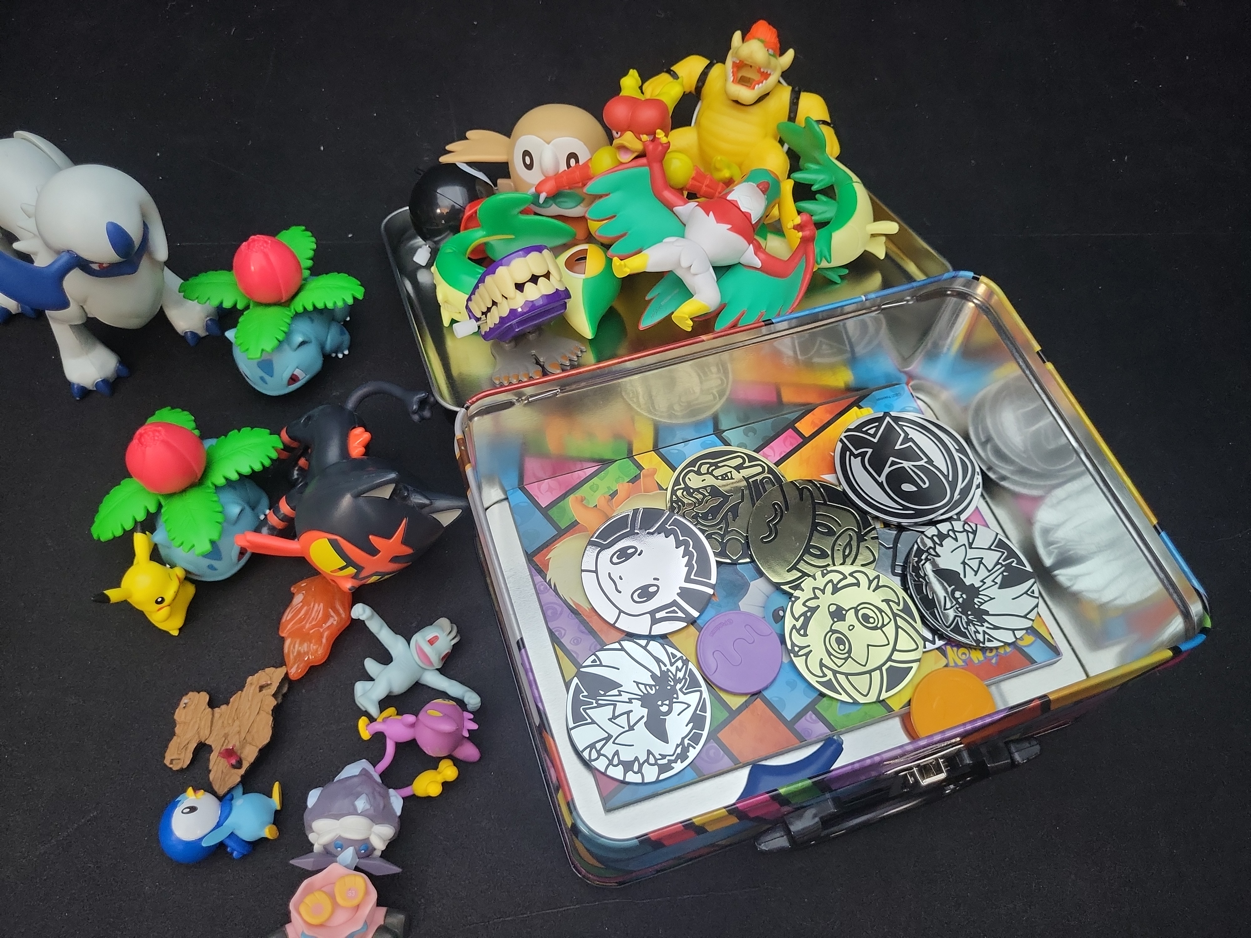 I02921 | A Collection of Pokemon TCG Collector Chest, Action Figures, and Gameplay Coins
