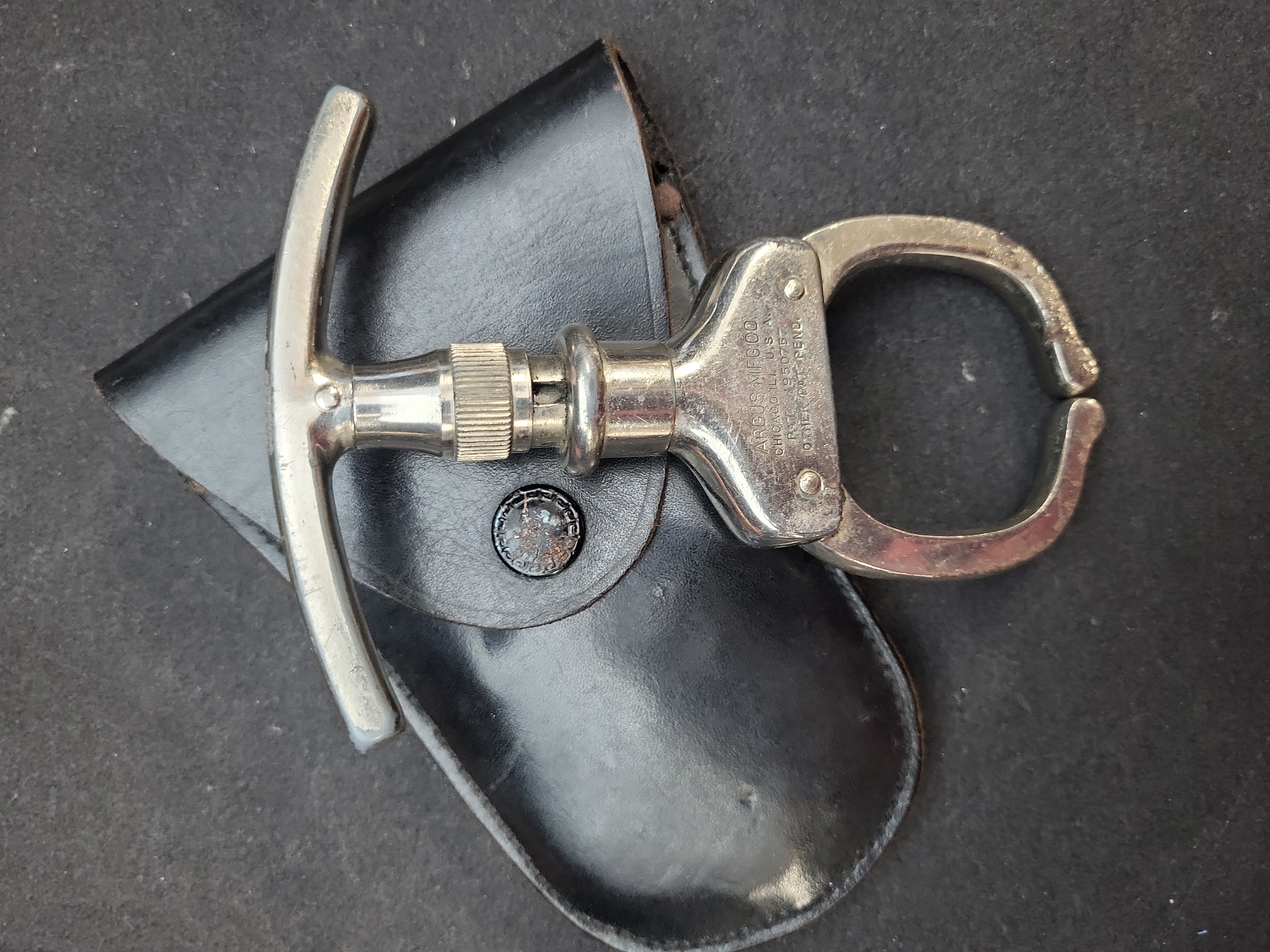I03657 | Argus Manufacturing Company The Iron Claw Police Come-Along Restraint with Leather Pouch
