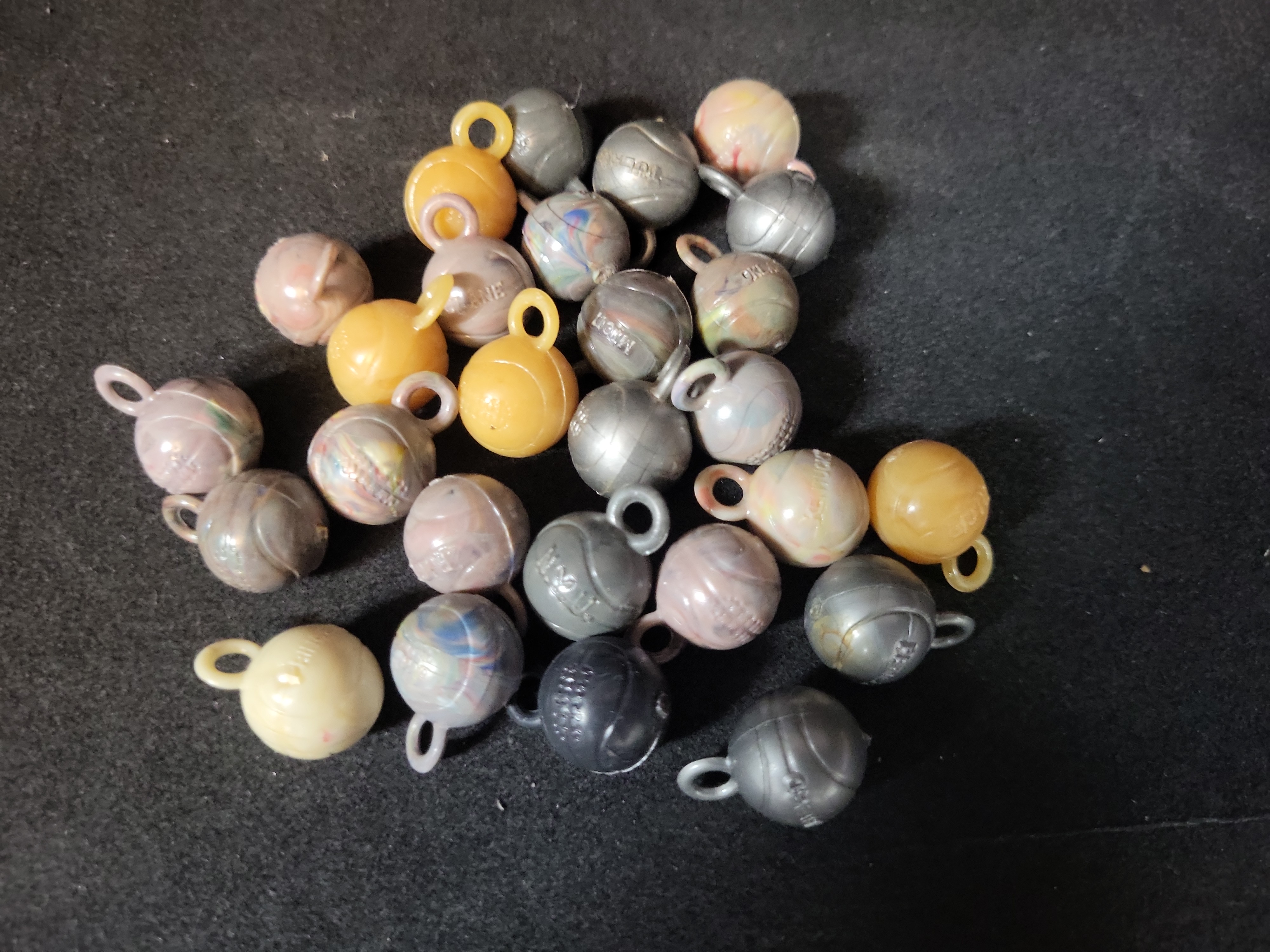 I03225 | A Collection of Vintage Molded Plastic Collegiate Sports Ball Charms