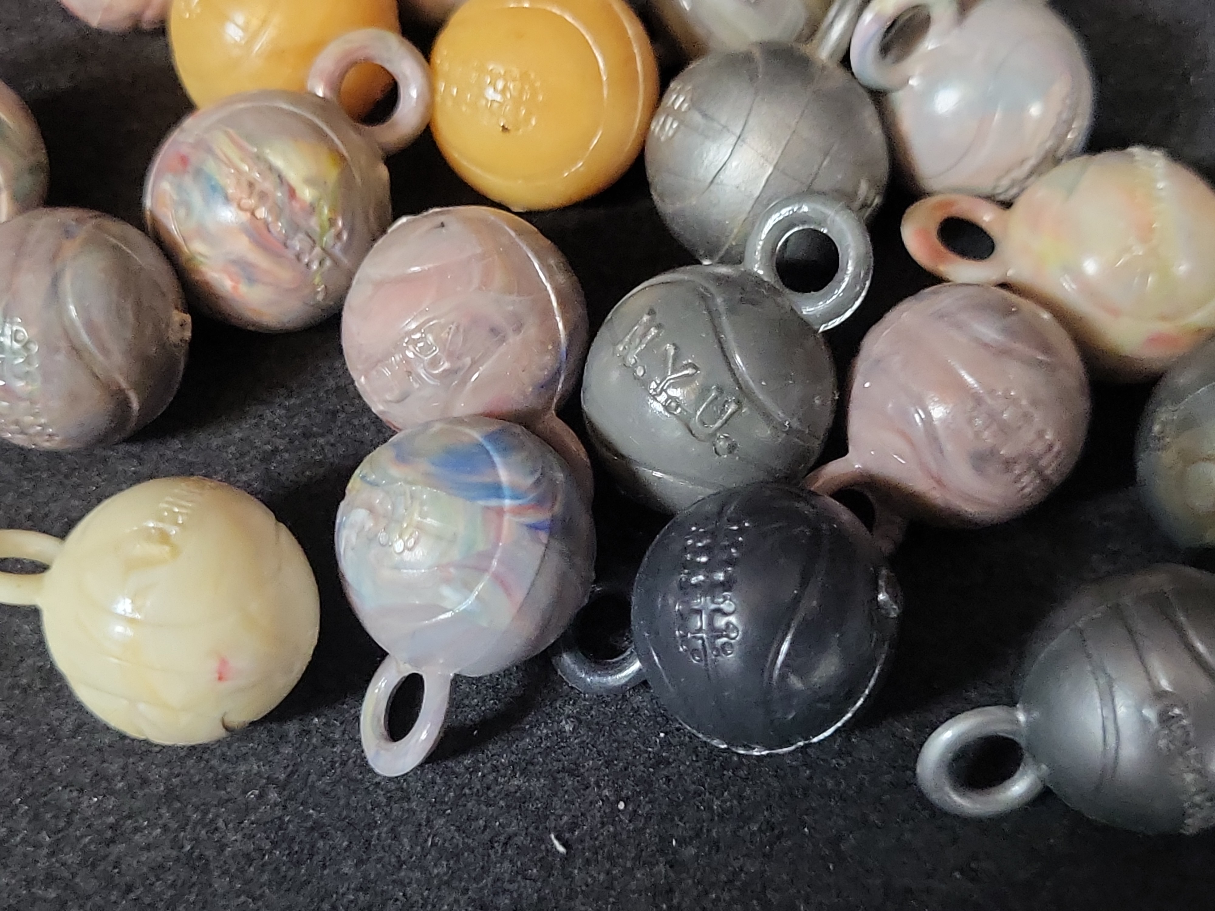 I03225 | A Collection of Vintage Molded Plastic Collegiate Sports Ball Charms