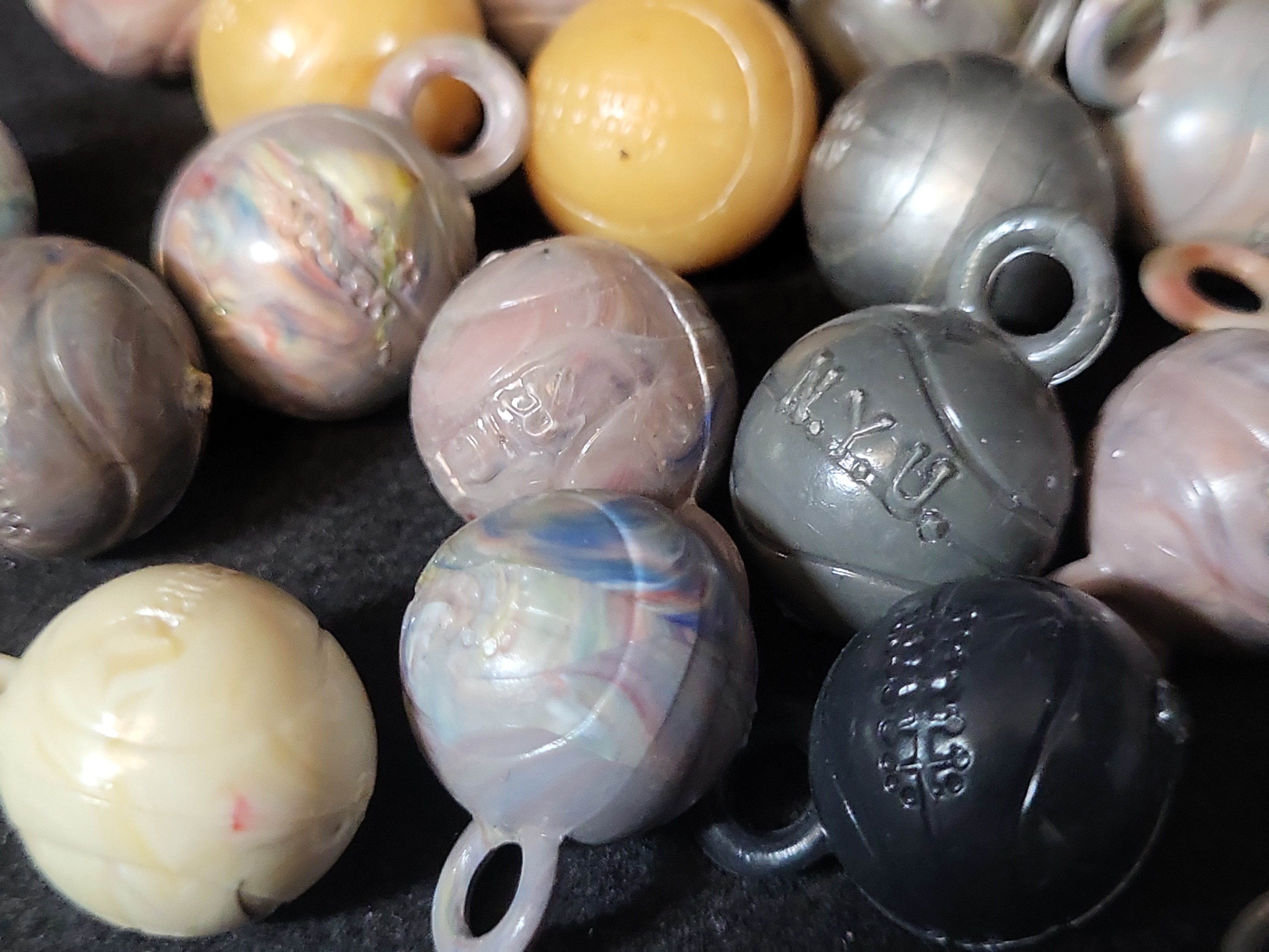 I03225 | A Collection of Vintage Molded Plastic Collegiate Sports Ball Charms