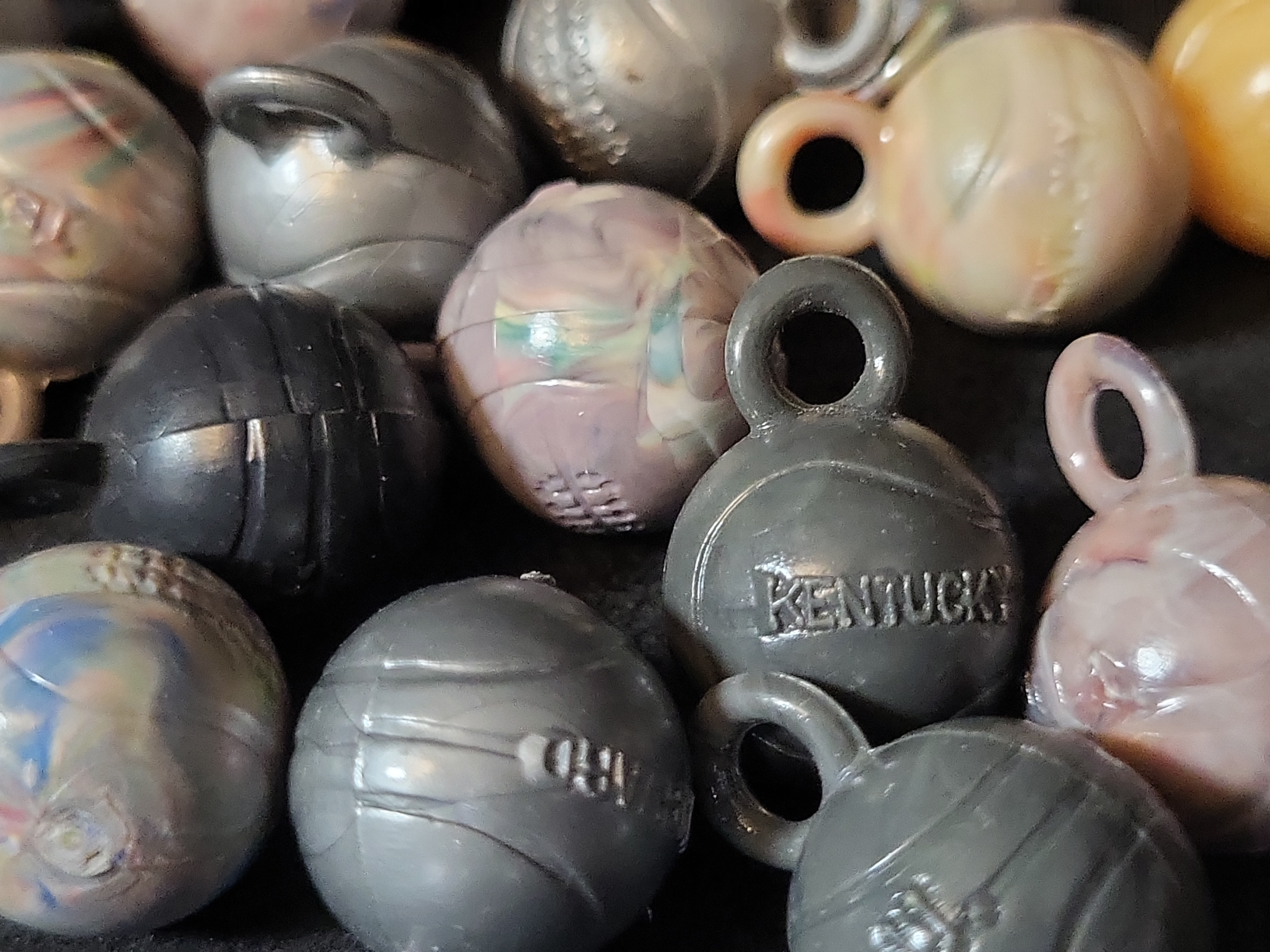 I03225 | A Collection of Vintage Molded Plastic Collegiate Sports Ball Charms