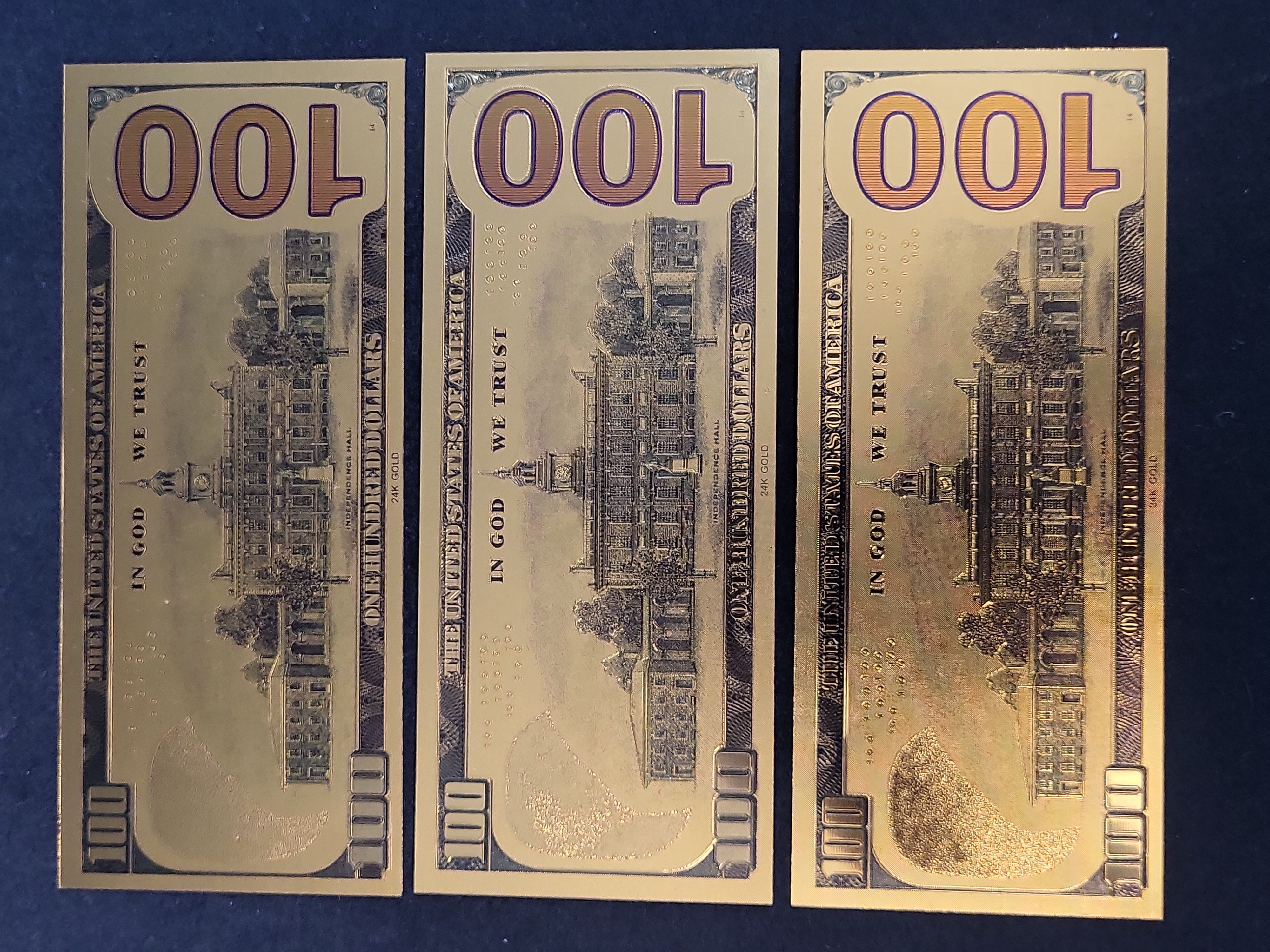 I03654 | A Trio of Kansas City Chiefs Gold Foil Novelty Banknotes Featuring Patrick Mahomes and Travis Kelce