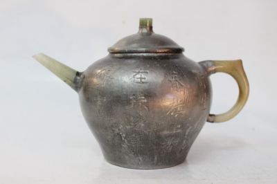 Chinese Yixing Zisha Teapot w Calligraphy. 7" W 4" H Please note the absence of a condition
