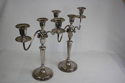 A pair of silver candle sticks circa 1960's