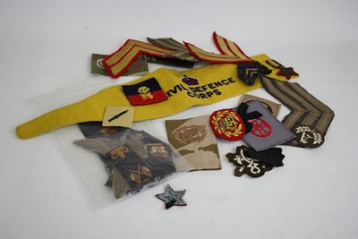 Small collection of badges i.e. rank slides &amp; chevrons &amp; civil defence arm band