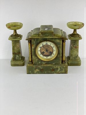 A Green Onyx Clock and Garniture