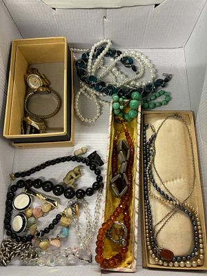 A box of costume jewellery including necklaces