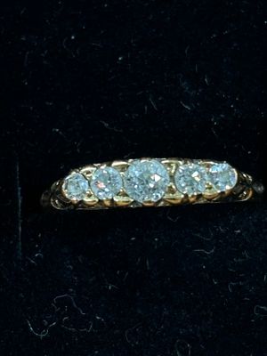 An 18ct Gold Five stone diamond dress ring size L weight 2.37 gm