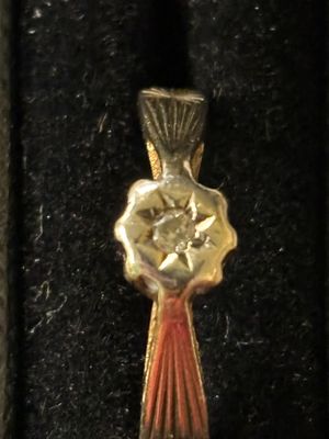 A yellow metal gold ring with an illusion set diamond weighs 1.63 gms size J