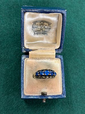 A yellow metal 9ct dress ring with five blue stones weight 4.42 gm size L 1/2