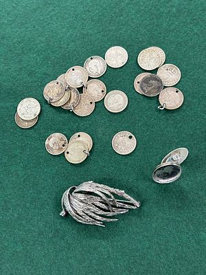 A selection of White metal and HM silver including a feather brooch marked 925 and a coin bracelet