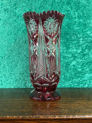 A large, Bohemian cut glass vase measuring 25 cm tall