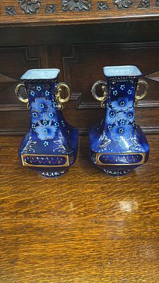 Two Blue vases with gold decoration measuring 25.5 cm tall