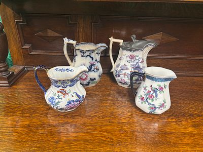 Four early 20th Century assorted jugs, including Losol ware one with metal lid a/f