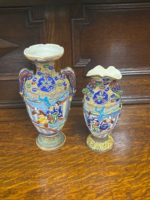 Two Satsuma style pottery vases measuring 23 cm and 19 cm tall