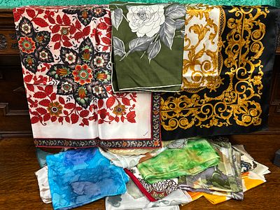 A box containing 40 assorted headscarves, some vintage designs and some silk