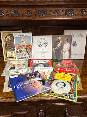 A box of Ephemera containing copies of The Telegraph chronicling The Death of King George, his 