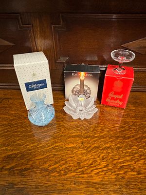 A Caithness vase, a small Royal Brierley dish and Kosta Linda candle holder, all in original boxes
