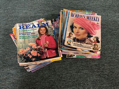 A box of magazines including Women's Realm, Woman's Weekly and People's Friend