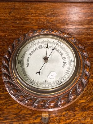 A early 20th century, oak bevelled aneroid barometer