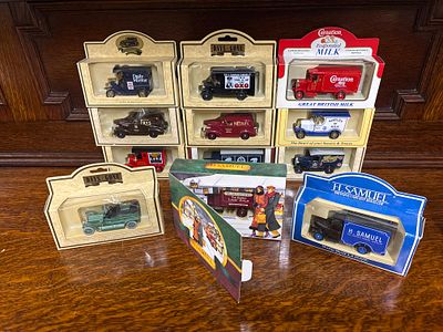 Twelve model vehicles all in original boxes to include H Samuel, Nestle's milk etc