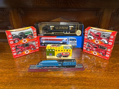 A Guinness Truck, an Esso truck, four boxed models based on 1940 Ford trucks (1:32 scale) 
