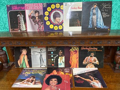 Thirteen Shirley Bassey LP records together with a concert program from 1992