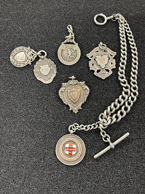 A HM silver watch chain and fob, together with five other HM Silver fobs awarded in 1930 ( 