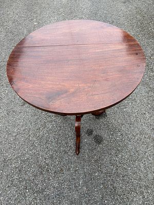 A 19th century circular tilt top table with pedestal and tripod legs, 61 cm diameter