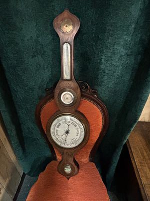 A 19th century mahogany framed banjo Barometer with later addition of an extra thermometer