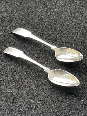 A pair of monogrammed Irish silver tea spoons, weighing 31.04 gm