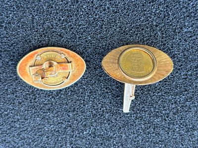 A pair of vintage 18 ct gold cufflinks of oval design inset with Venezuela commemorative 