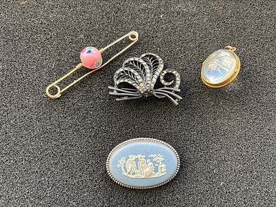 A selection of costume jewellery including a Wedgwood brooch