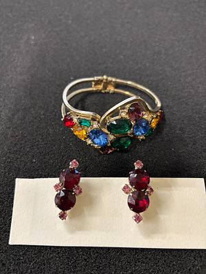 Pair of clip on earrings together with a complementing hinged bangle